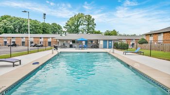 Sparkling swimming pool with sundeck